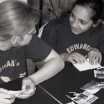 Two girls discuss their designs